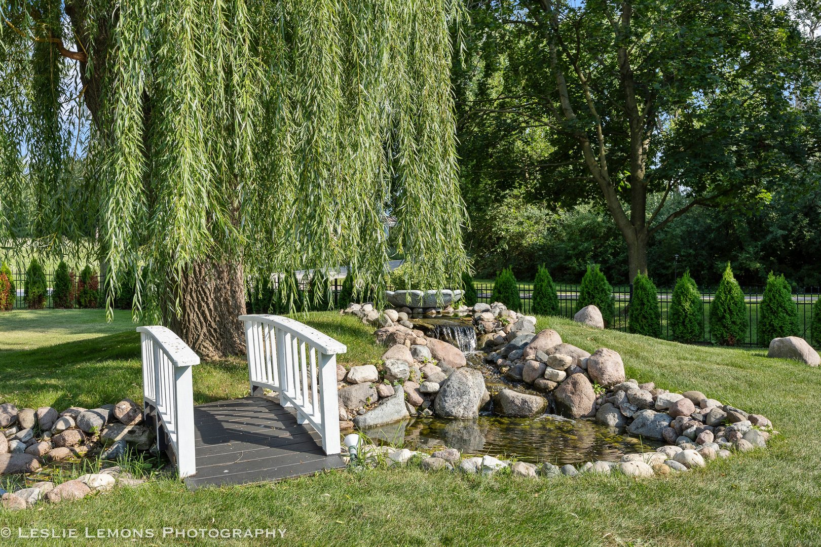 8S452 Bell Drive Naperville, IL 60565 - Photo 44 of 59 a view of a deck with table and chairs and wooden fence
