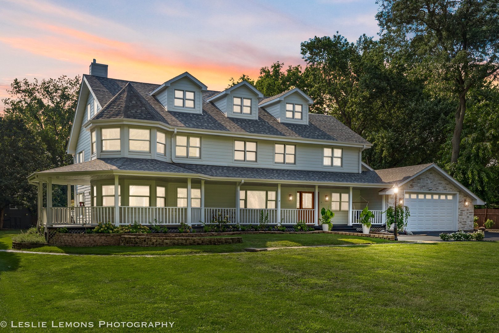 8S452 Bell Drive Naperville, IL 60565 - Photo 46 of 59 a front view of a house with a garden and yard