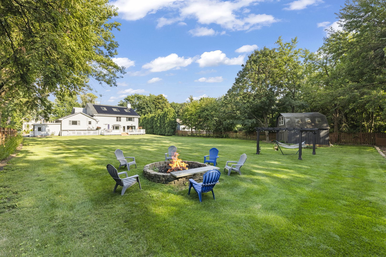 8S452 Bell Drive Naperville, IL 60565 - Photo 49 of 59 a backyard of a house with table and chairs