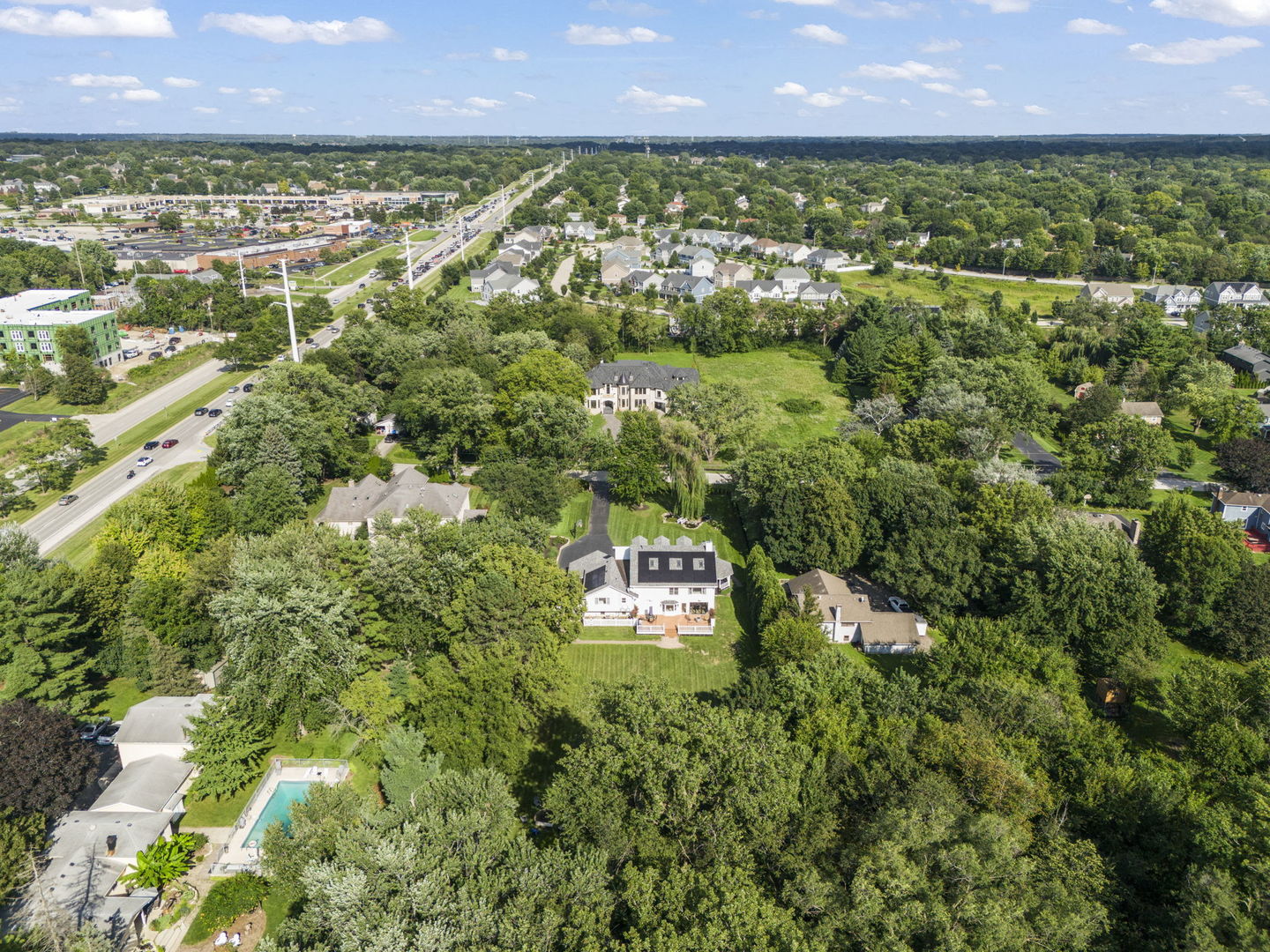 8S452 Bell Drive Naperville, IL 60565 - Photo 52 of 59 an aerial view of residential building with outdoor space and trees all around