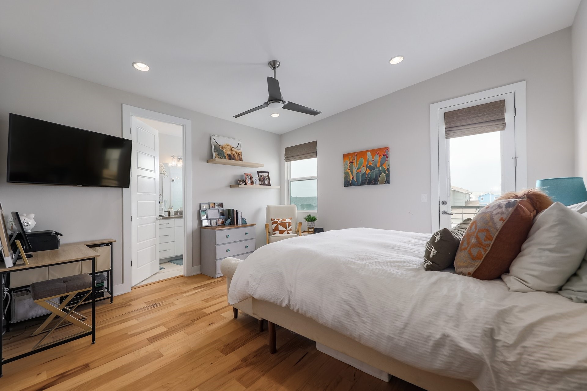 7013 Boyle Drive Austin, TX 78724 - Photo 17 of 32 a bedroom with a bed and a flat screen tv