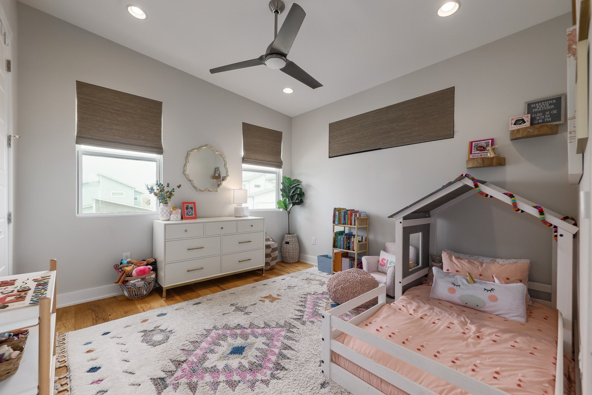 7013 Boyle Drive Austin, TX 78724 - Photo 22 of 32 a bedroom with a bed and wooden floor