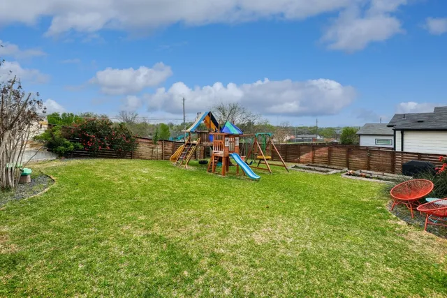 a view of a yard with a slide