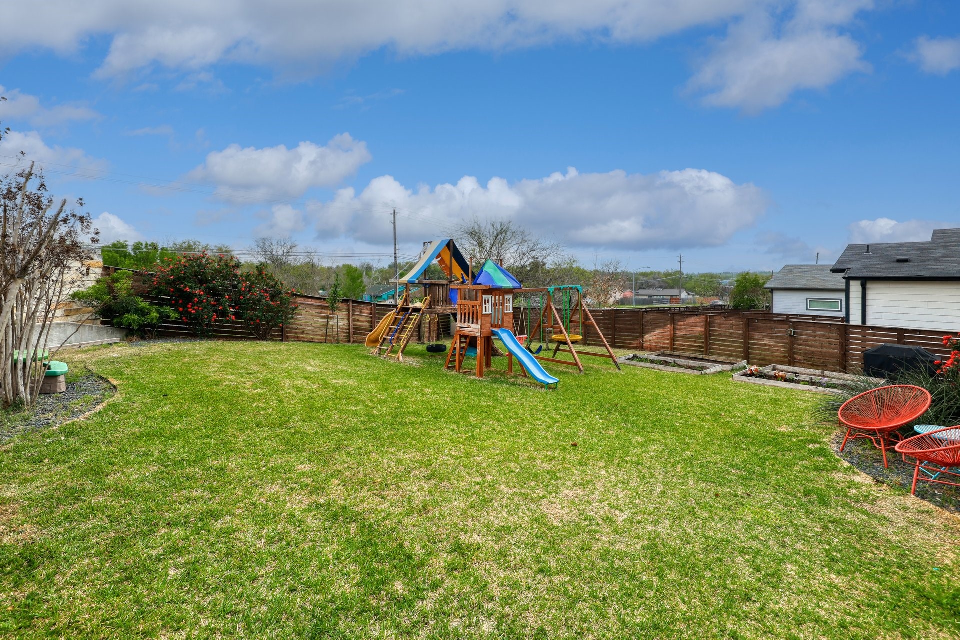 7013 Boyle Drive Austin, TX 78724 - Photo 27 of 32 a view of a yard with a slide