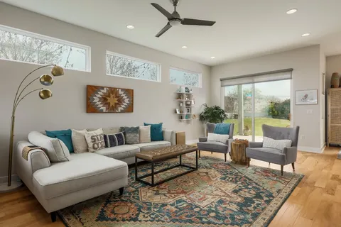 a living room with furniture or couch and a large window