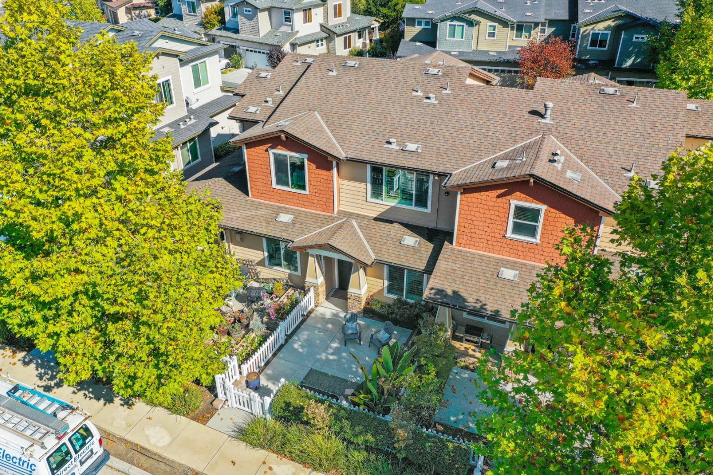 an aerial view of residential houses with yard