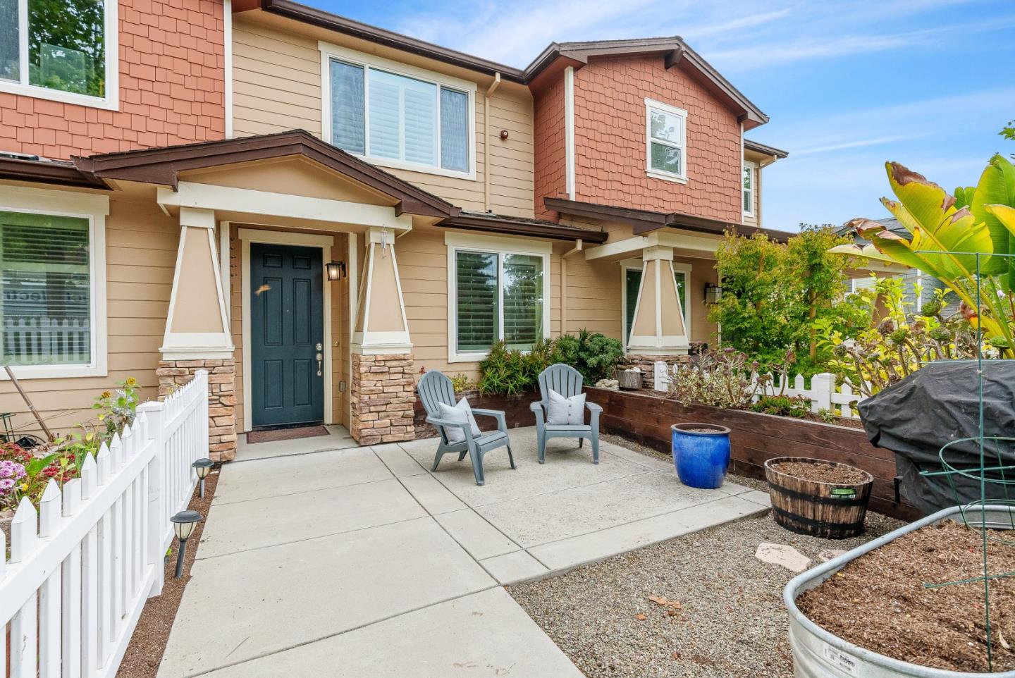 142 Atherton Loop Aptos, CA 95003 - Photo 2 of 21 a view of a patio with couches table and chairs and potted plants