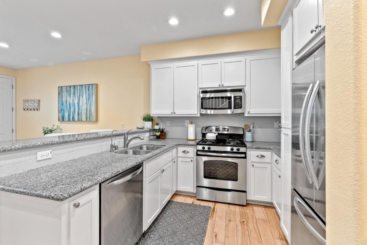 142 Atherton Loop Aptos, CA 95003 - Photo 8 of 21 a kitchen with a sink stove and microwave