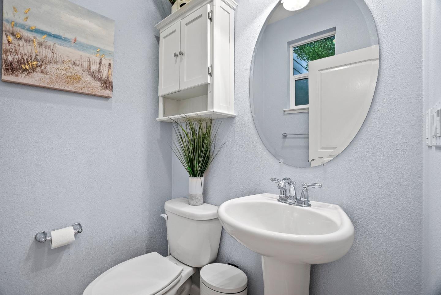 142 Atherton Loop Aptos, CA 95003 - Photo 9 of 21 a bathroom with a toilet sink and mirror