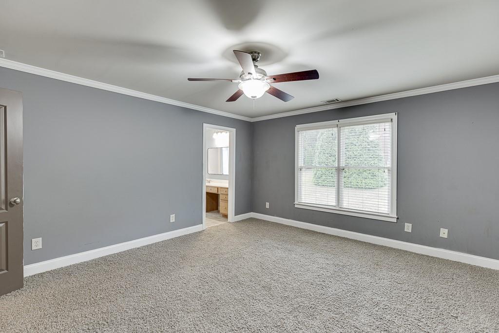 940 Chateau Forest Road Hoschton, GA 30548 - Photo 52 of 87 a view of an empty room with a window
