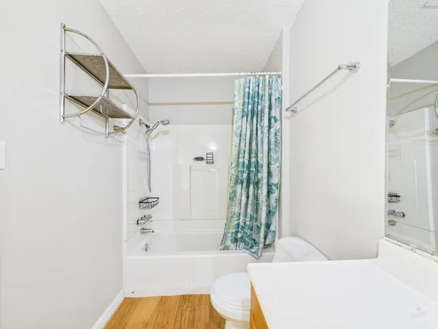 a bathroom with a bathtub and shower