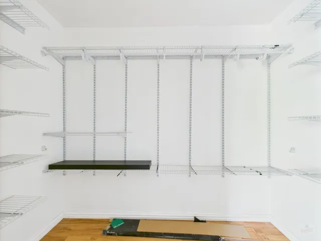 a view of room with wooden floor