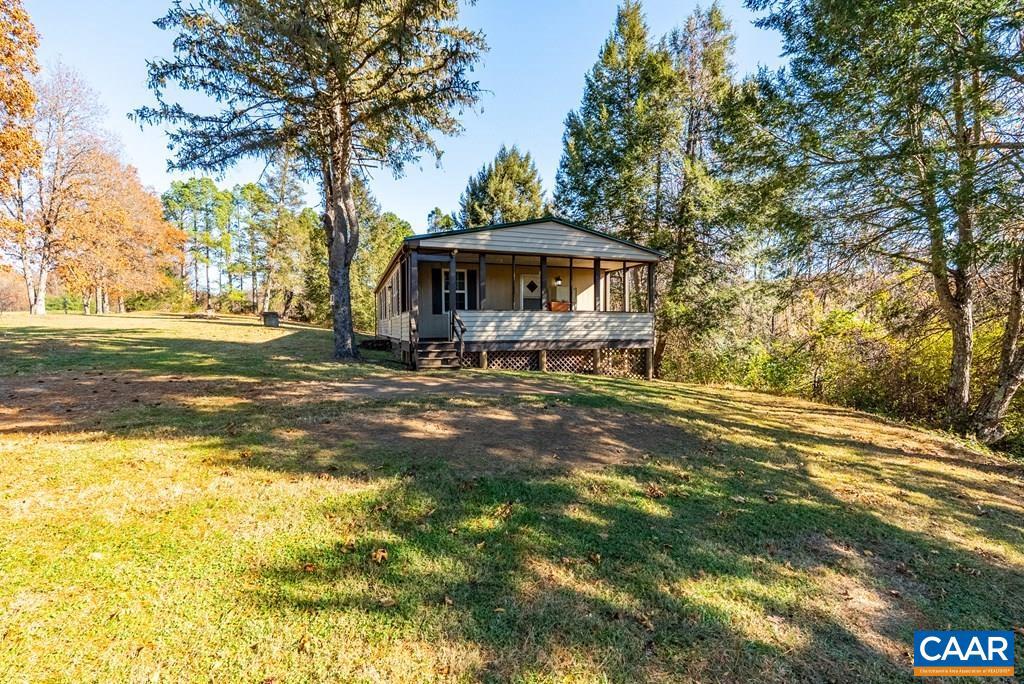 1066 Stevens Cove Road Lovingston, VA 22949 - Photo 28 of 34 a view of a house with a yard