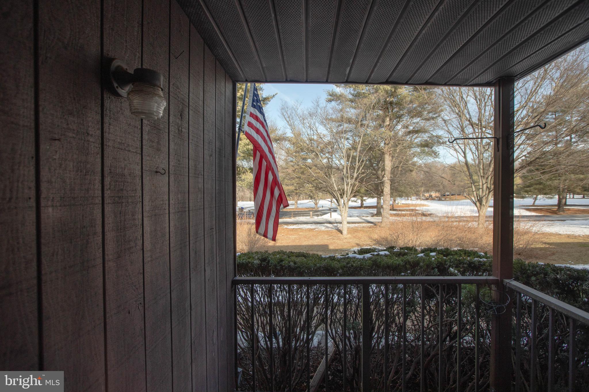 6 Bozarth Court Hamilton, NJ 08690 - Photo 17 of 21 a view of a balcony with wooden floor and a table