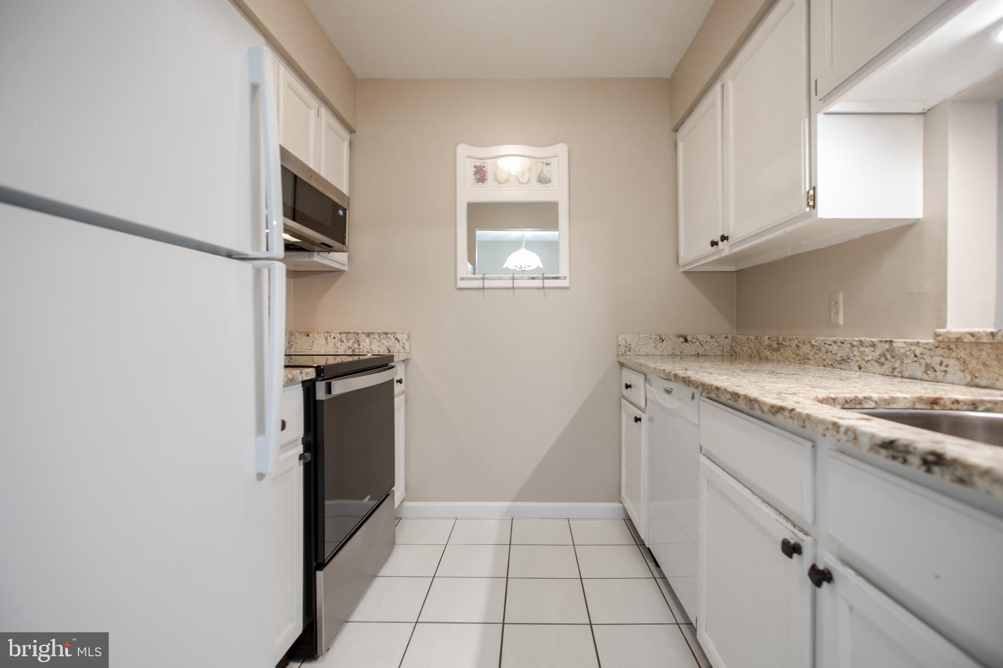 6 Bozarth Court Hamilton, NJ 08690 - Photo 6 of 21 a kitchen with white cabinets and appliances