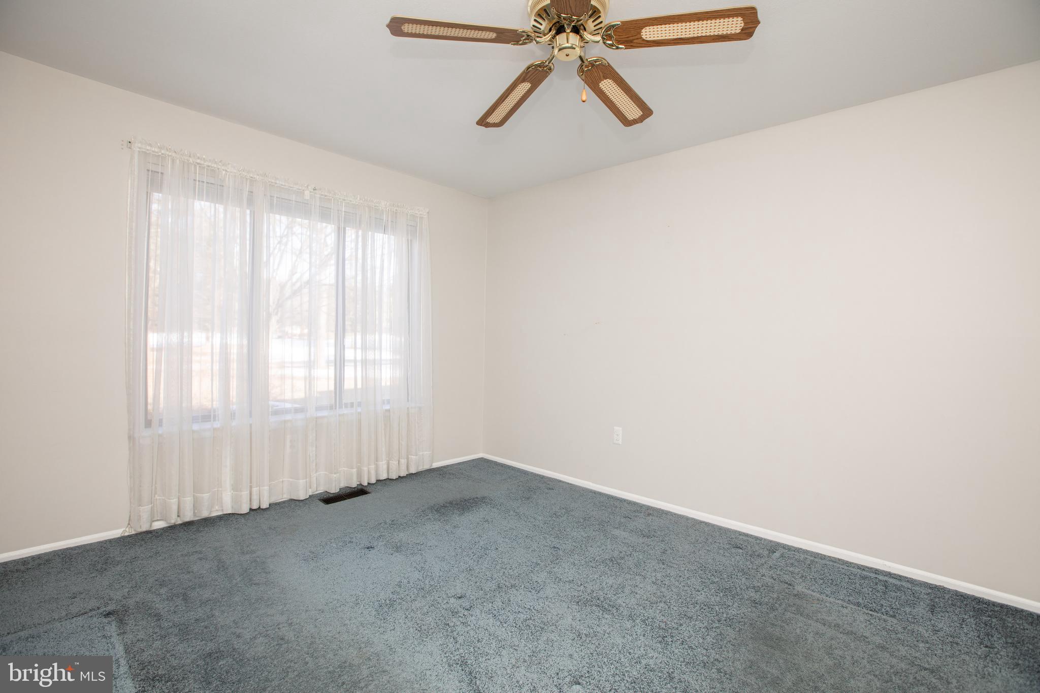 6 Bozarth Court Hamilton, NJ 08690 - Photo 8 of 21 an empty room with windows and fan