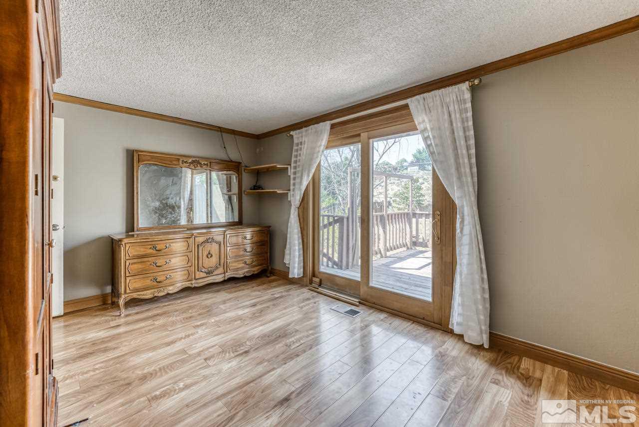 3645 Bryan Street Reno, NV 89503 - Photo 13 of 38 wooden floor in an empty room with a window