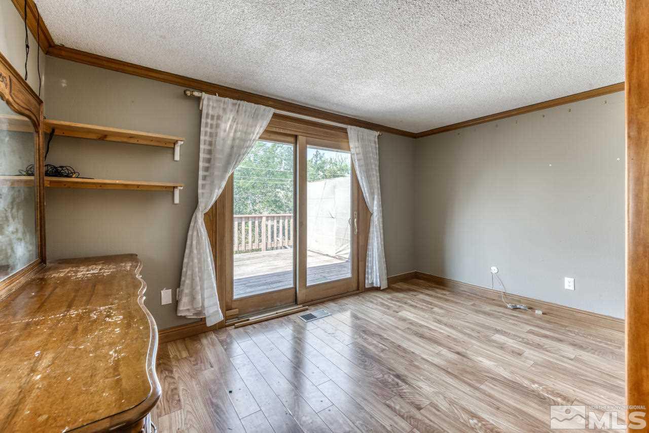 3645 Bryan Street Reno, NV 89503 - Photo 14 of 38 an empty room with wooden floor and windows
