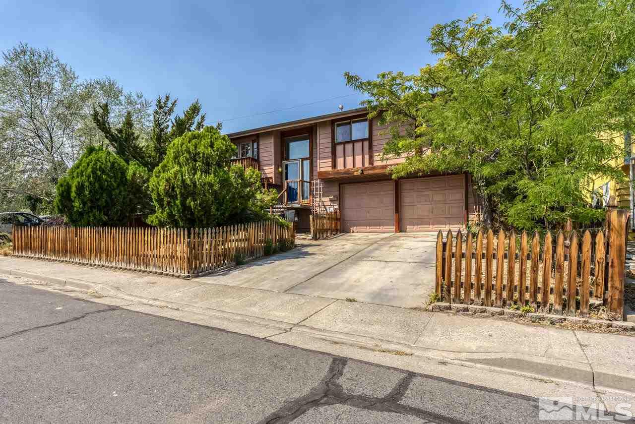 3645 Bryan Street Reno, NV 89503 - Photo 2 of 38 a front view of a house with a garden