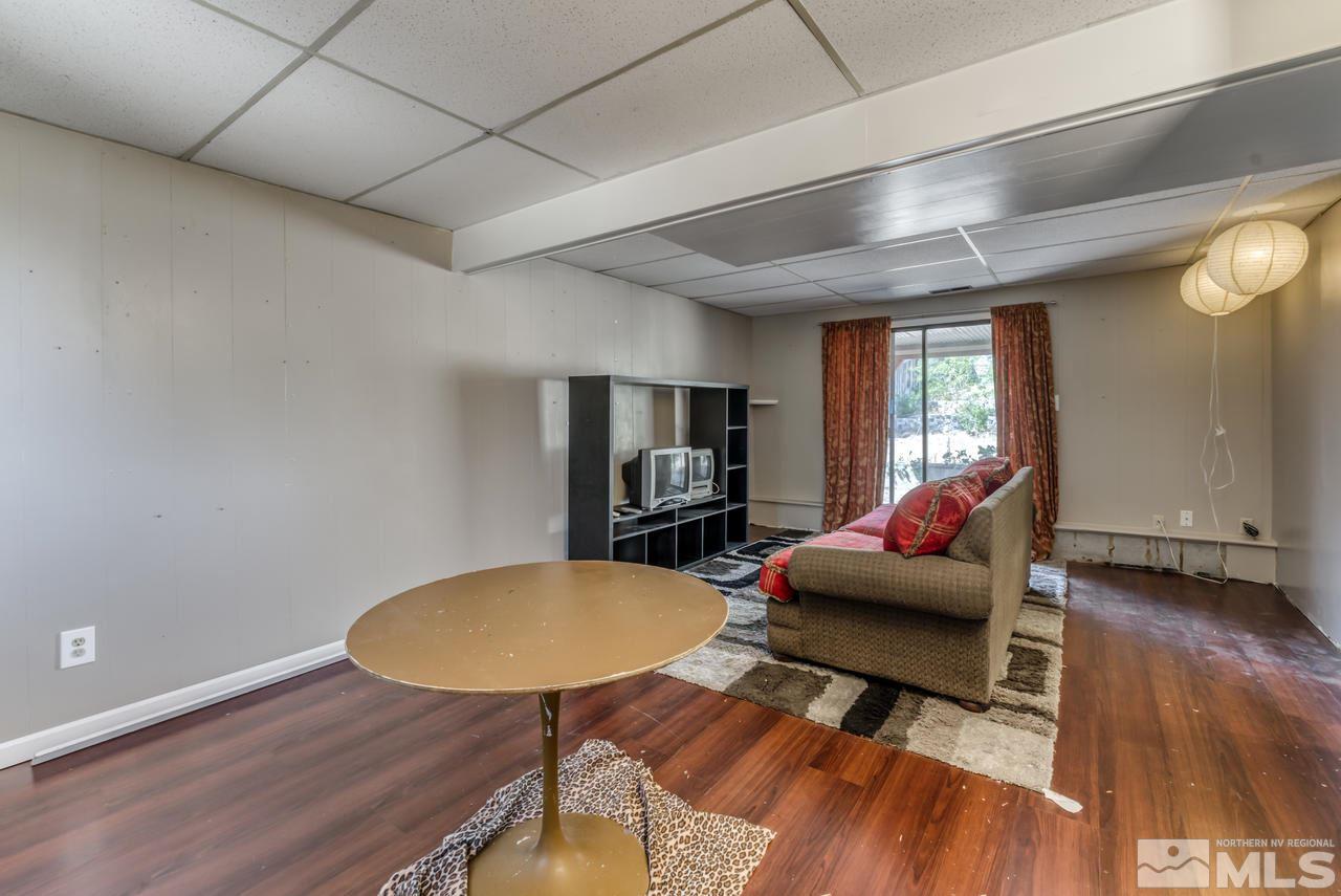 3645 Bryan Street Reno, NV 89503 - Photo 22 of 38 a living room with furniture and a wooden floor