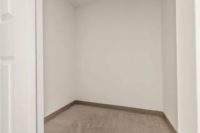 an aerial view of a residential houses with outdoor space