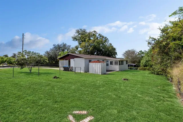 a house view with a play ground in front of it