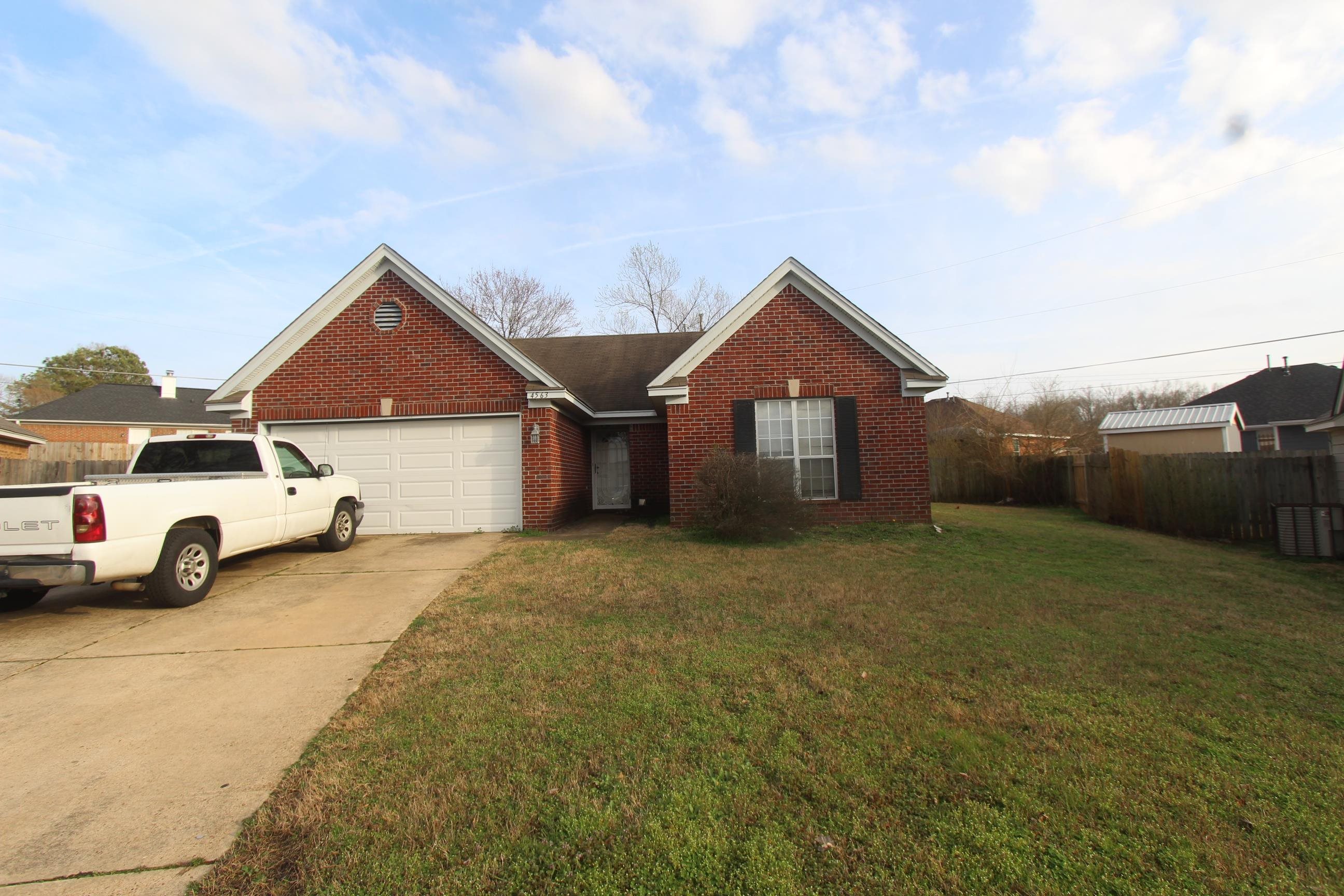 4563 Cedargreen Cove Memphis, TN 38128 - Photo 2 of 12 a view of a car parked in front of a house