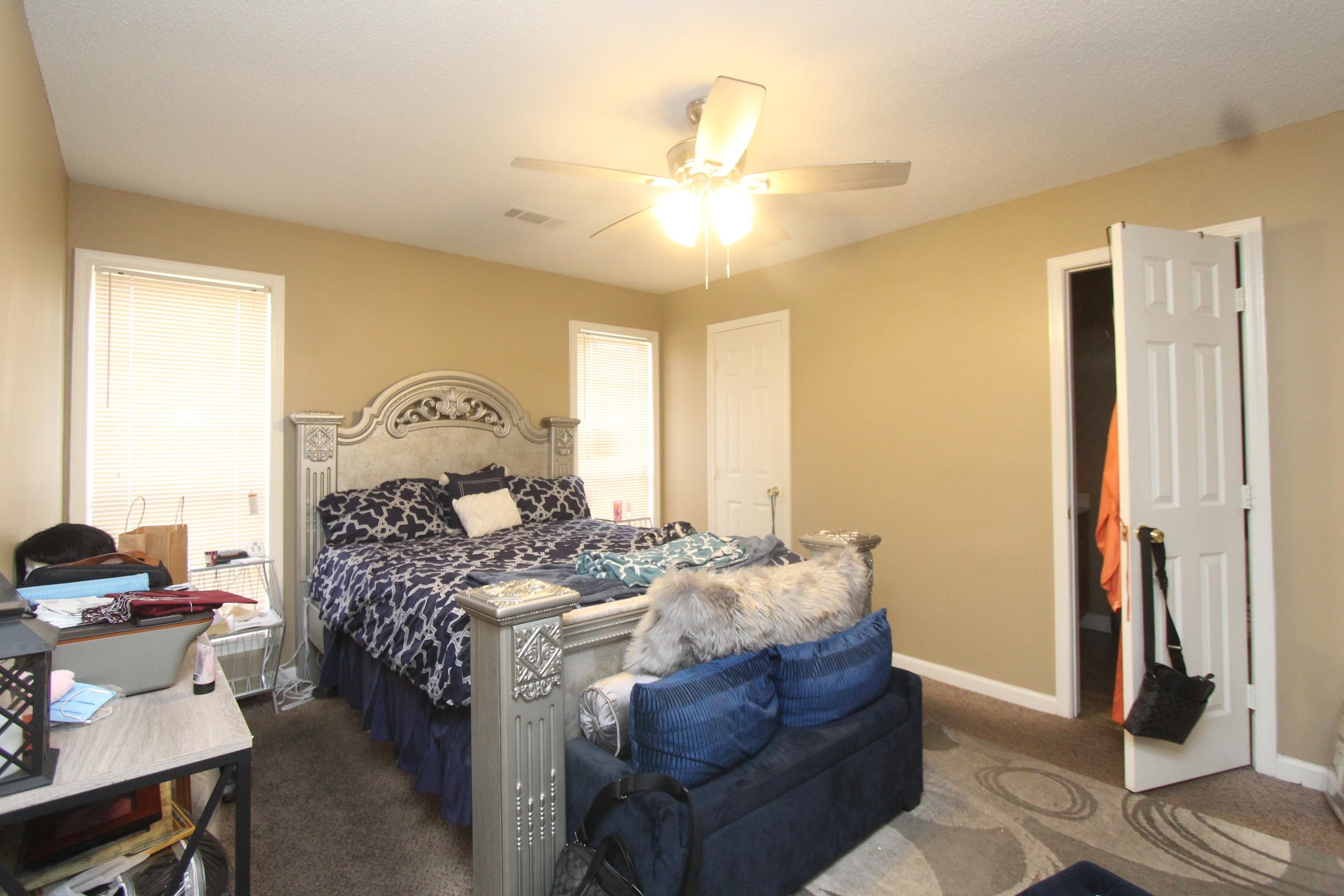 4563 Cedargreen Cove Memphis, TN 38128 - Photo 7 of 12 a living room with furniture and a chandelier