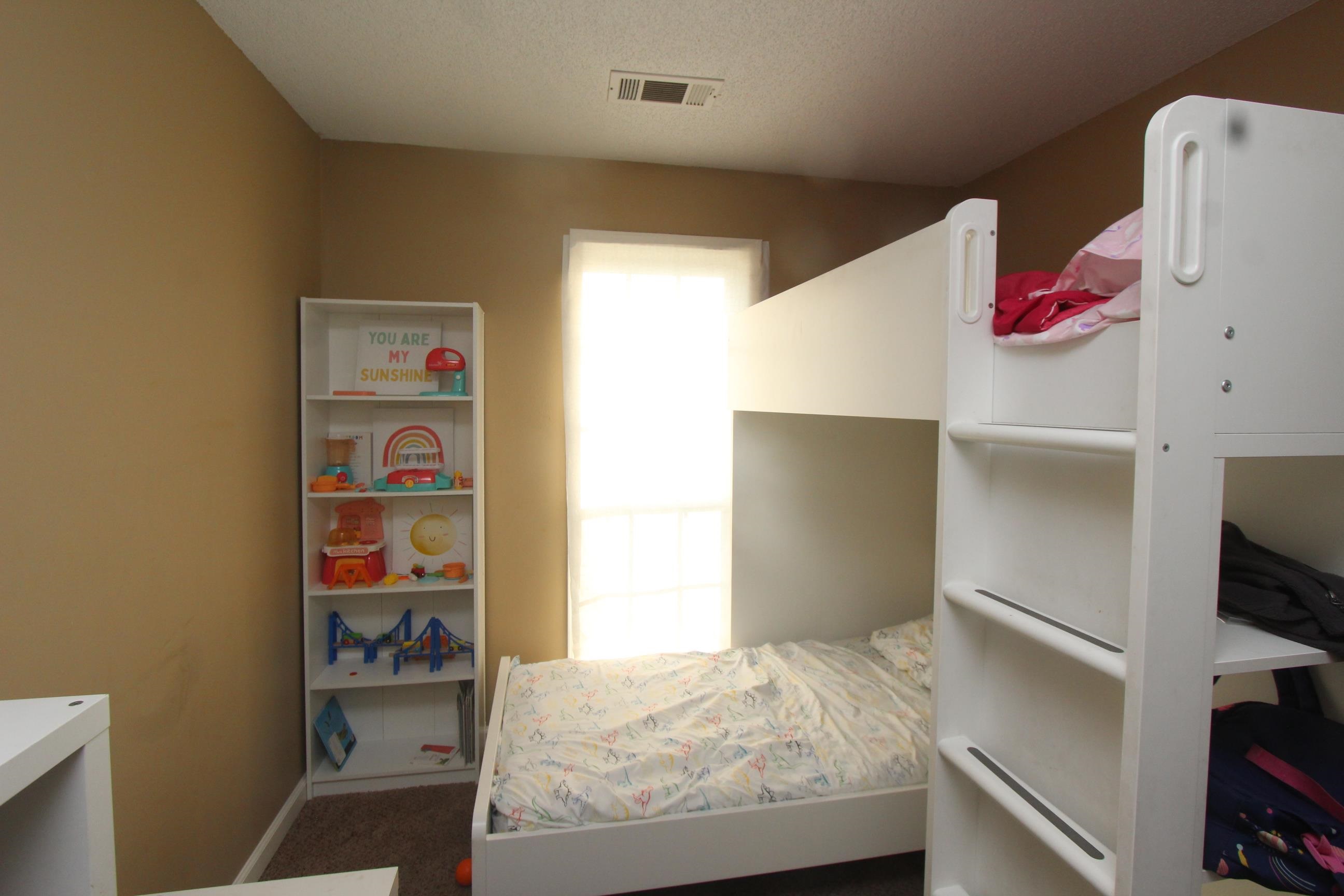 4563 Cedargreen Cove Memphis, TN 38128 - Photo 9 of 12 a bedroom with a bed and closet