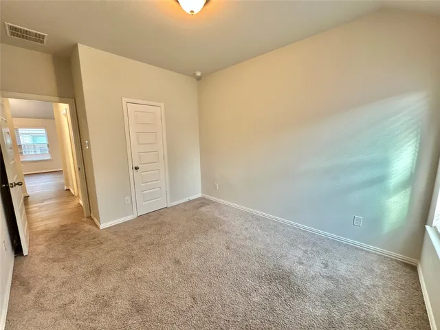 a large kitchen with stainless steel appliances kitchen island granite countertop a large counter top and a stove top oven