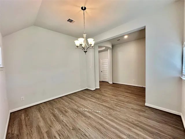 a view of a livingroom with a chandelier fan