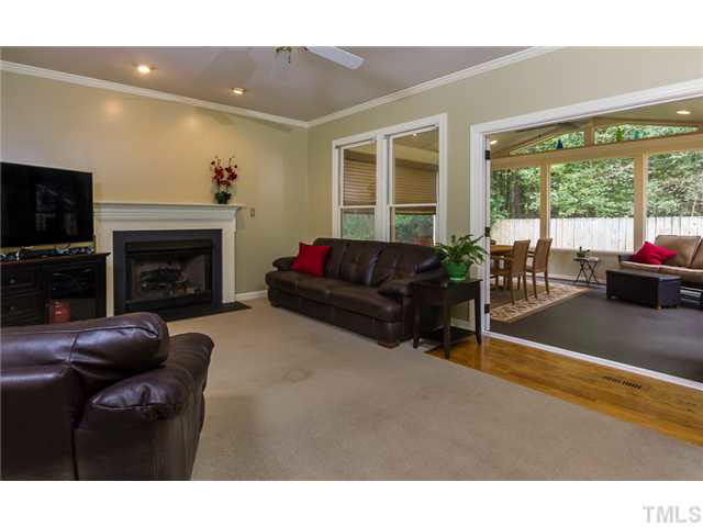 2637 Jasper Lane Raleigh, NC 27613 - Photo 3 of 25 a living room with furniture a window and a fireplace