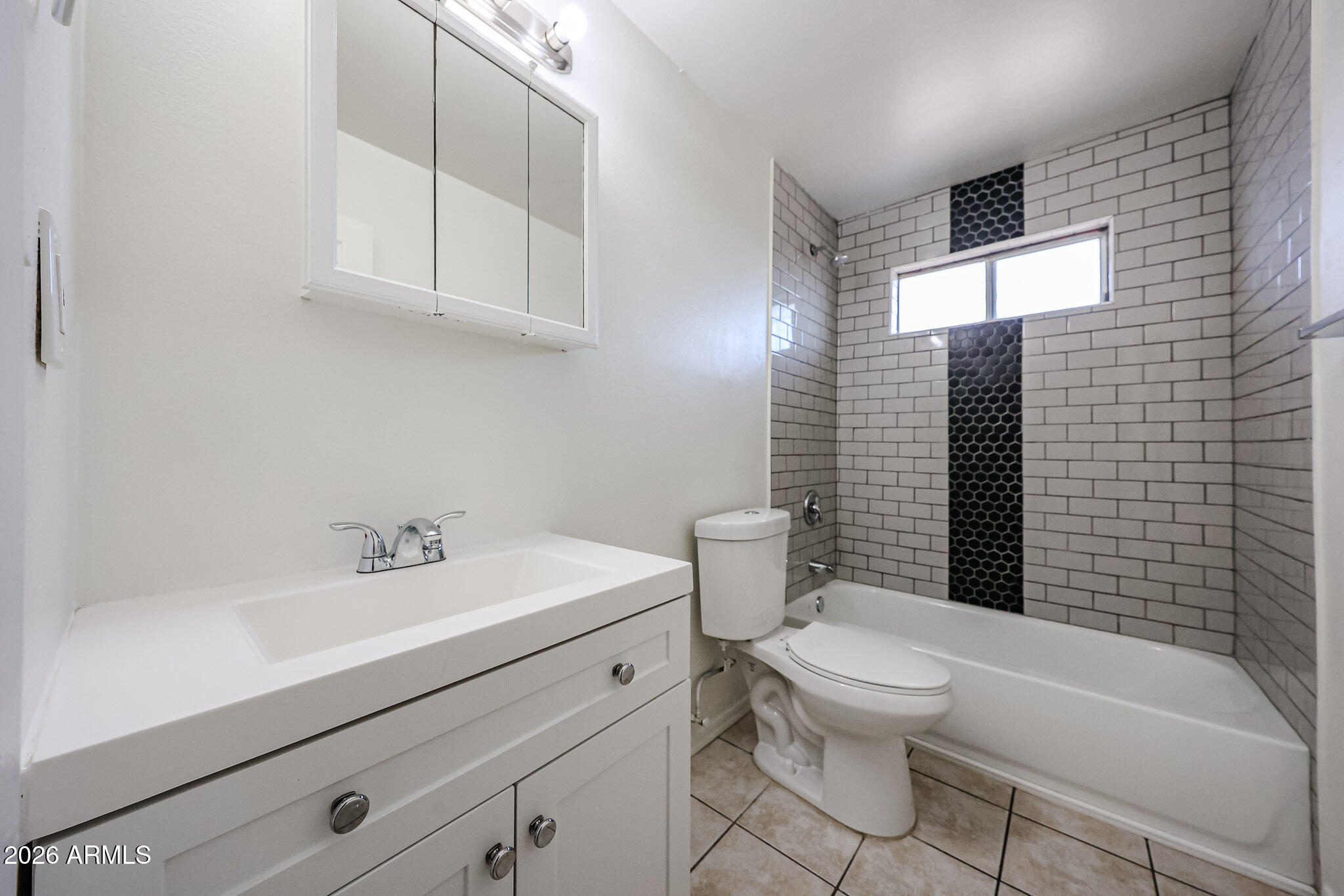 2226 West Heatherbrae Drive, Unit 4 Phoenix, AZ 85015 - Photo 14 of 17 a bathroom with a sink a toilet and shower