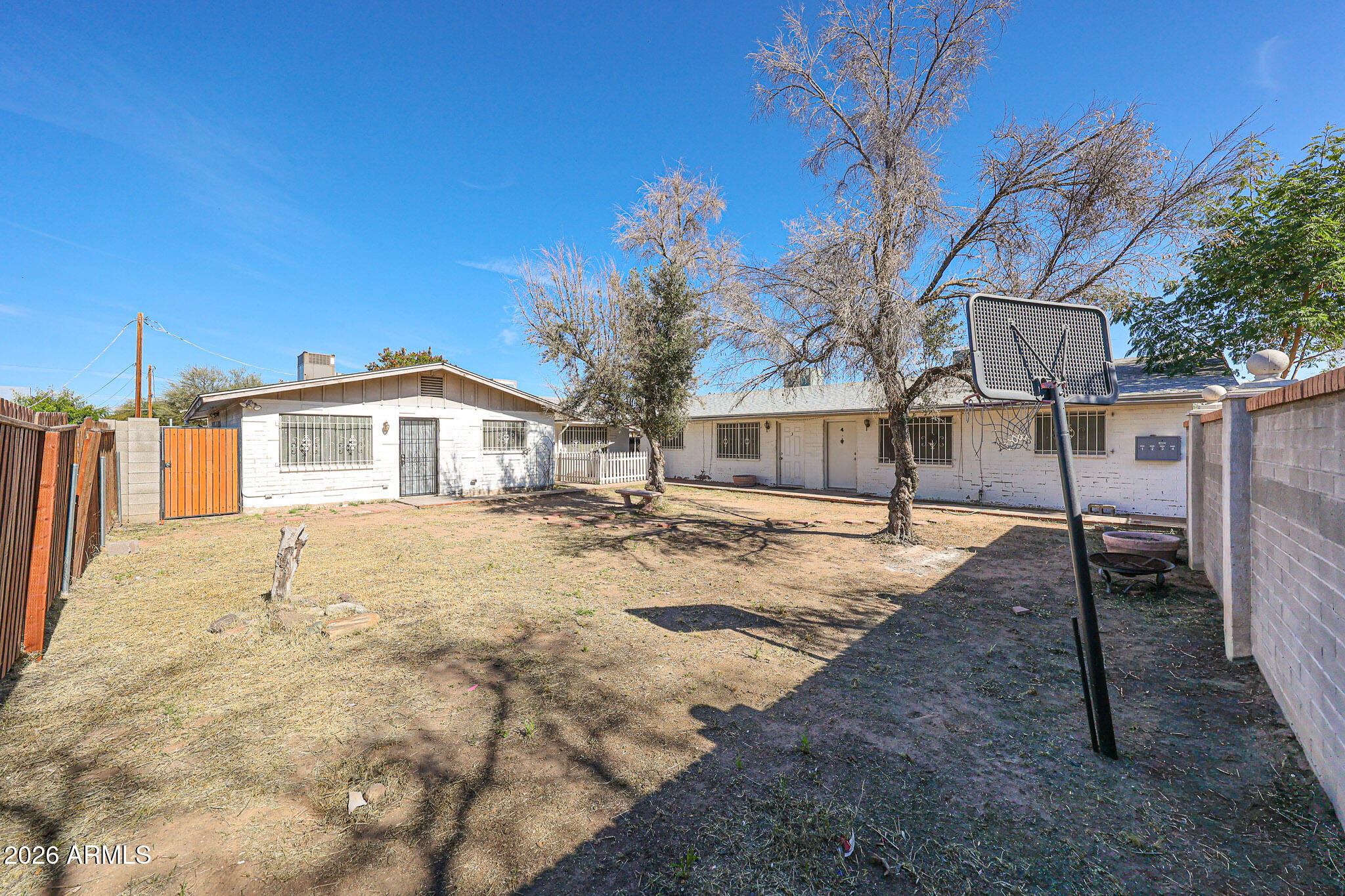 2226 West Heatherbrae Drive, Unit 4 Phoenix, AZ 85015 - Photo 3 of 17 a front view of a house with a yard and garage
