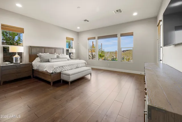 a room with a bed and a large window