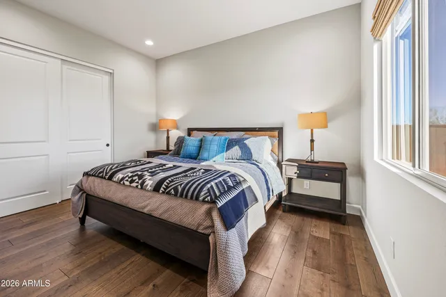 a bedroom with a bed and a window