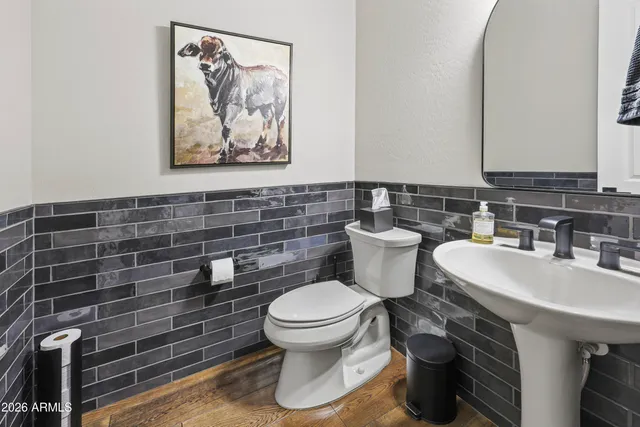 a dining room with furniture window and wooden floor