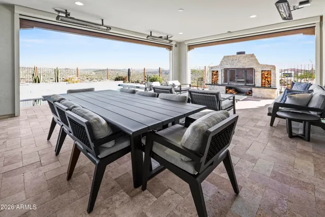 a living room with furniture and a floor to ceiling window