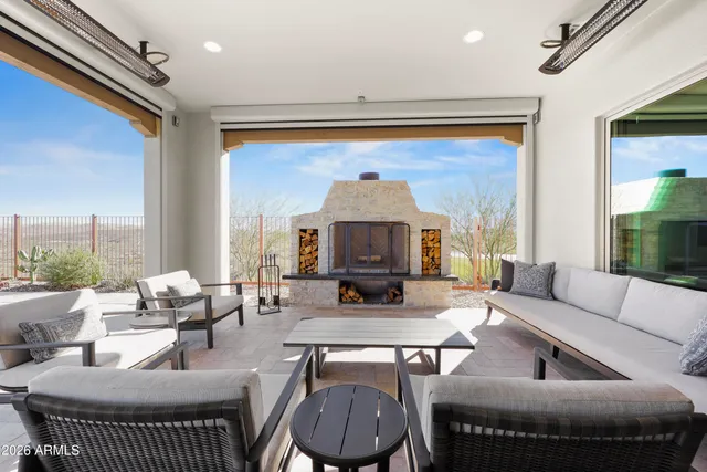 a view of swimming pool with outdoor seating