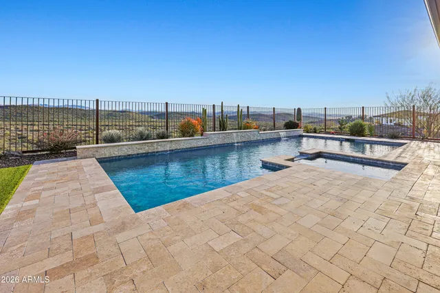a view of a swimming pool with a chairs