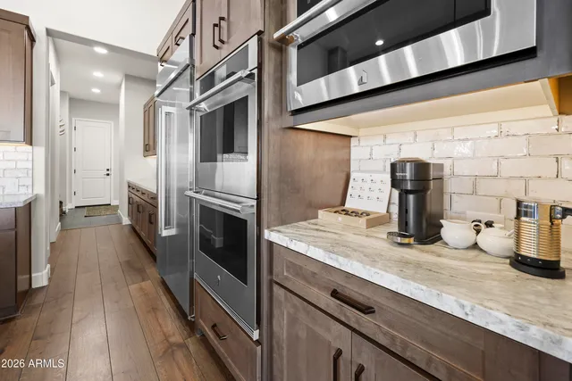 a kitchen with a sink and refrigerator