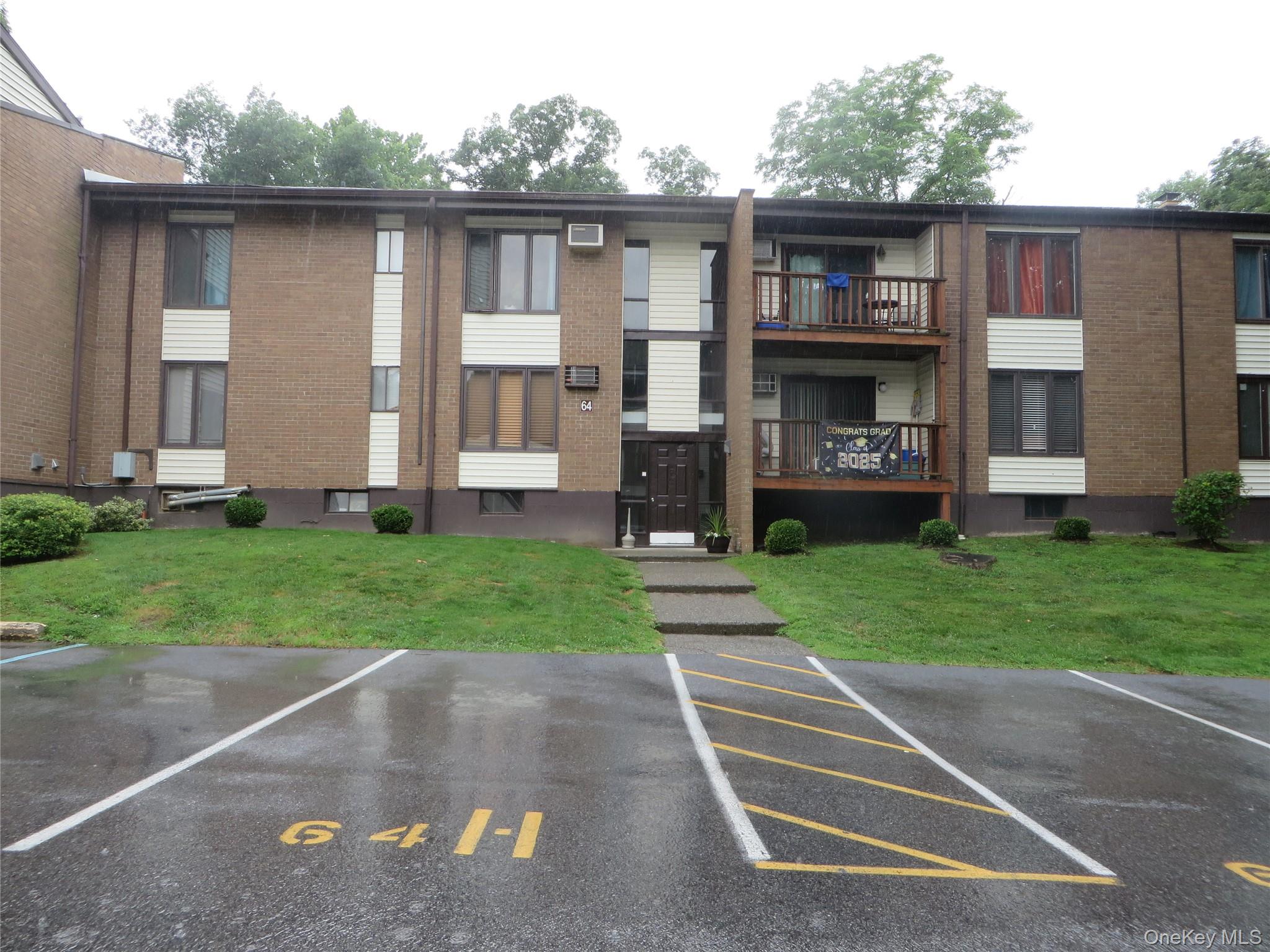 3 Hook Road, Unit 64C Poughkeepsie, NY 12601 - Photo 3 of 15 a front view of house with yard and green space