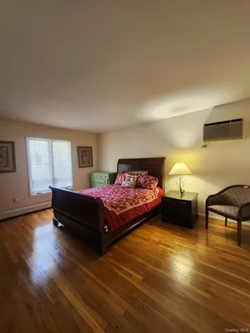 a spacious bedroom with a bed and a couch