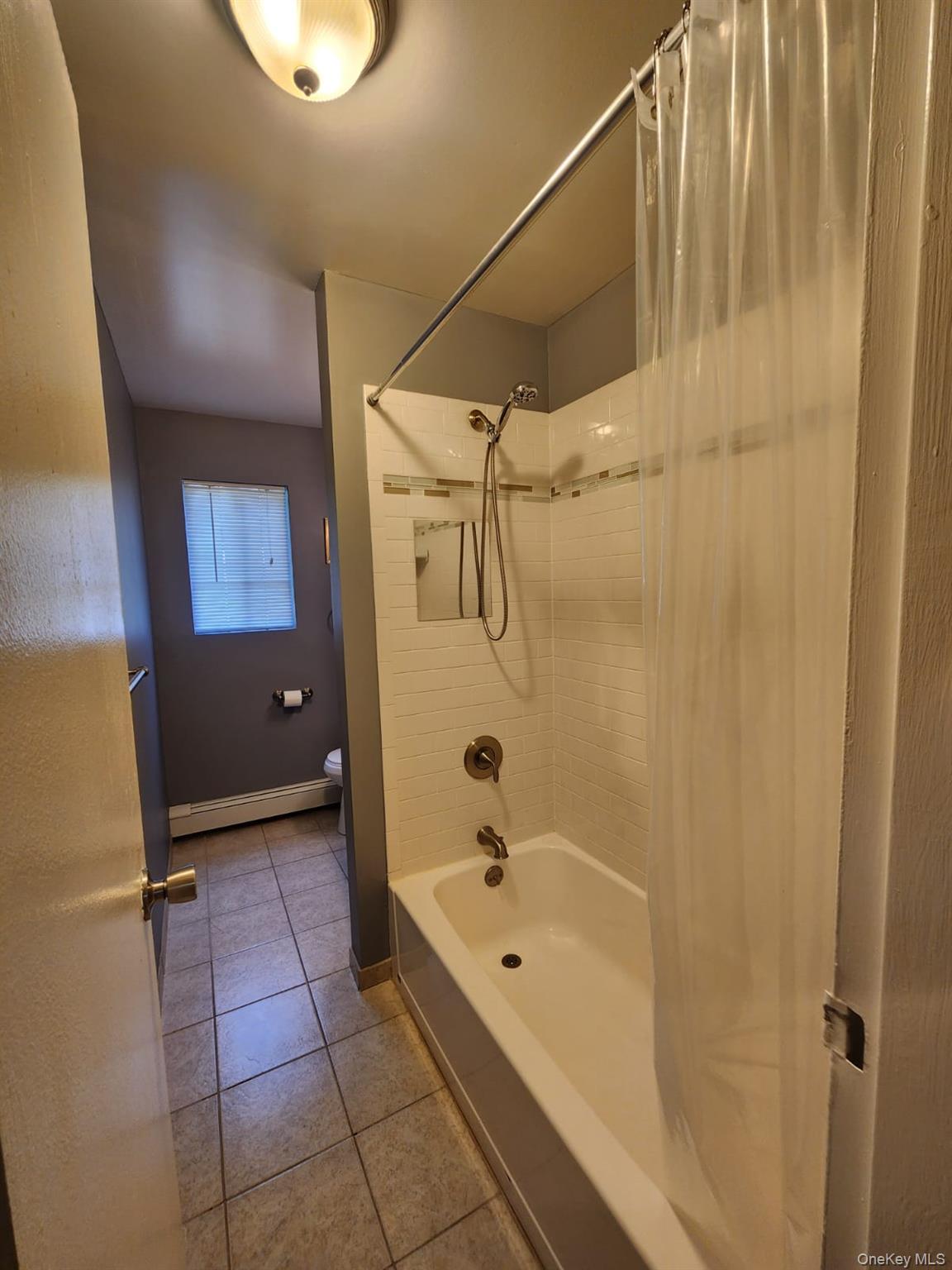 3 Hook Road, Unit 64C Poughkeepsie, NY 12601 - Photo 8 of 15 a bathroom with a bathtub and a shower