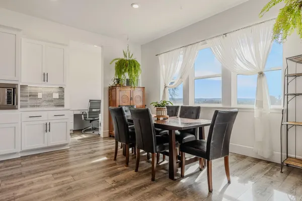 a view of a dining room with furniture and window