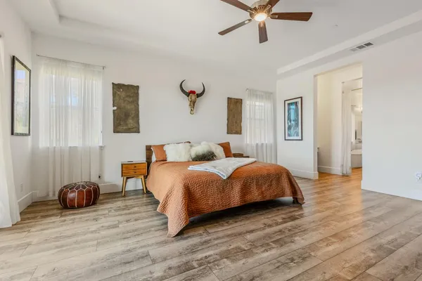 a bedroom with a bed and window