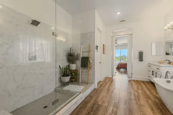 a large space with a lot of counter space and a wooden floor