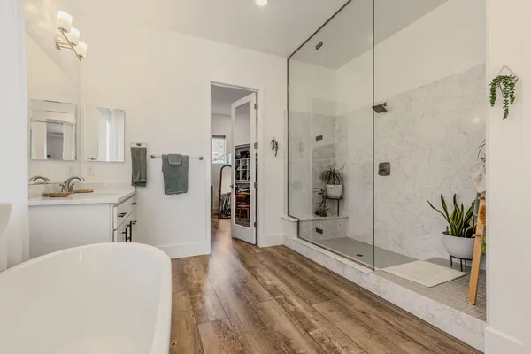 a spacious bathroom with a shower and a sink