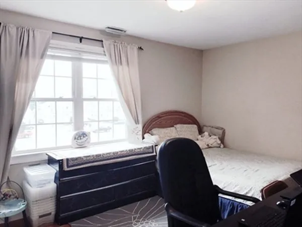 a room with a chair and a window