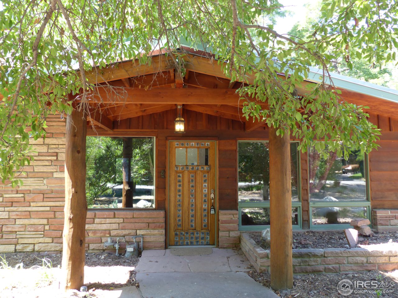 751 Gapter Road Boulder, CO 80303 - Photo 1 of 24 a front view of a house with a yard